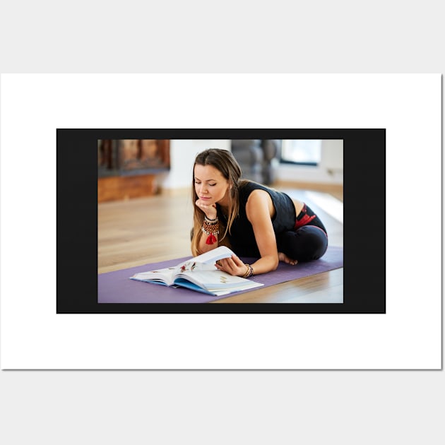 Young woman reading a yoga book Wall Art by naturalis